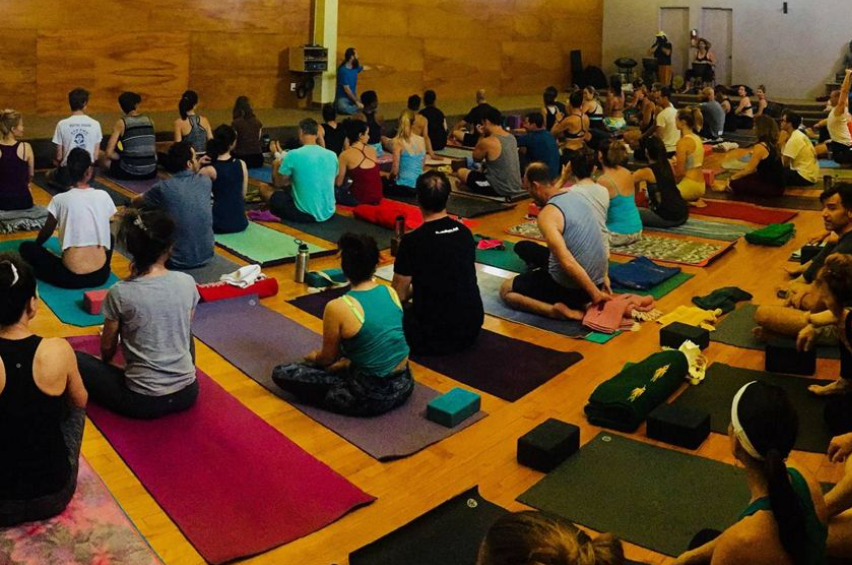 instructor guiding a small yoga group